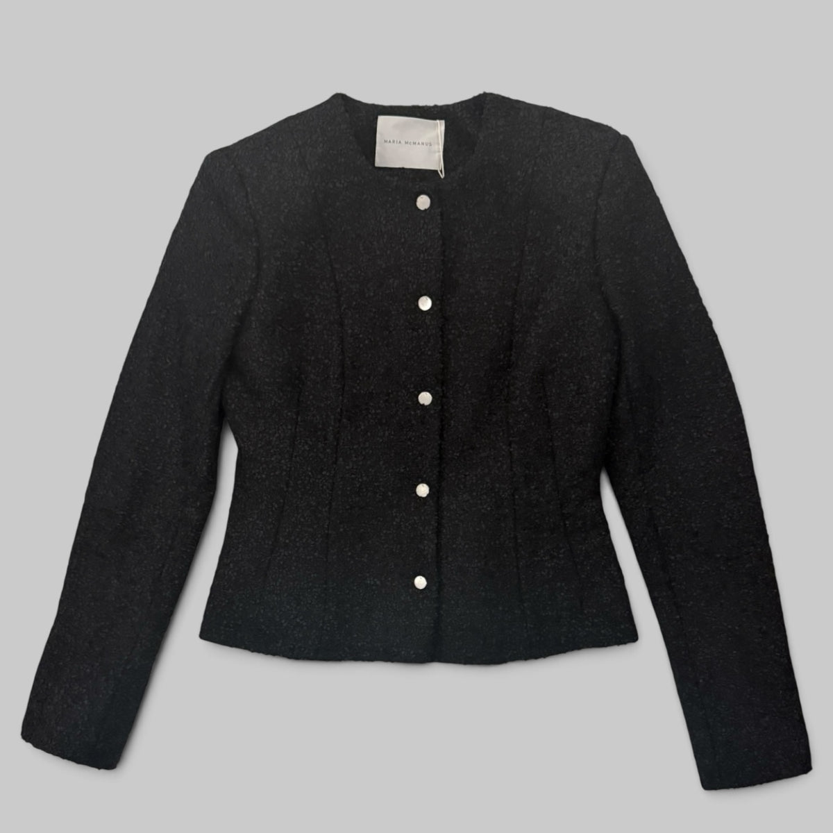 Maria McManus Crew Neck Peplum Jacket in Black — peplum hem detail