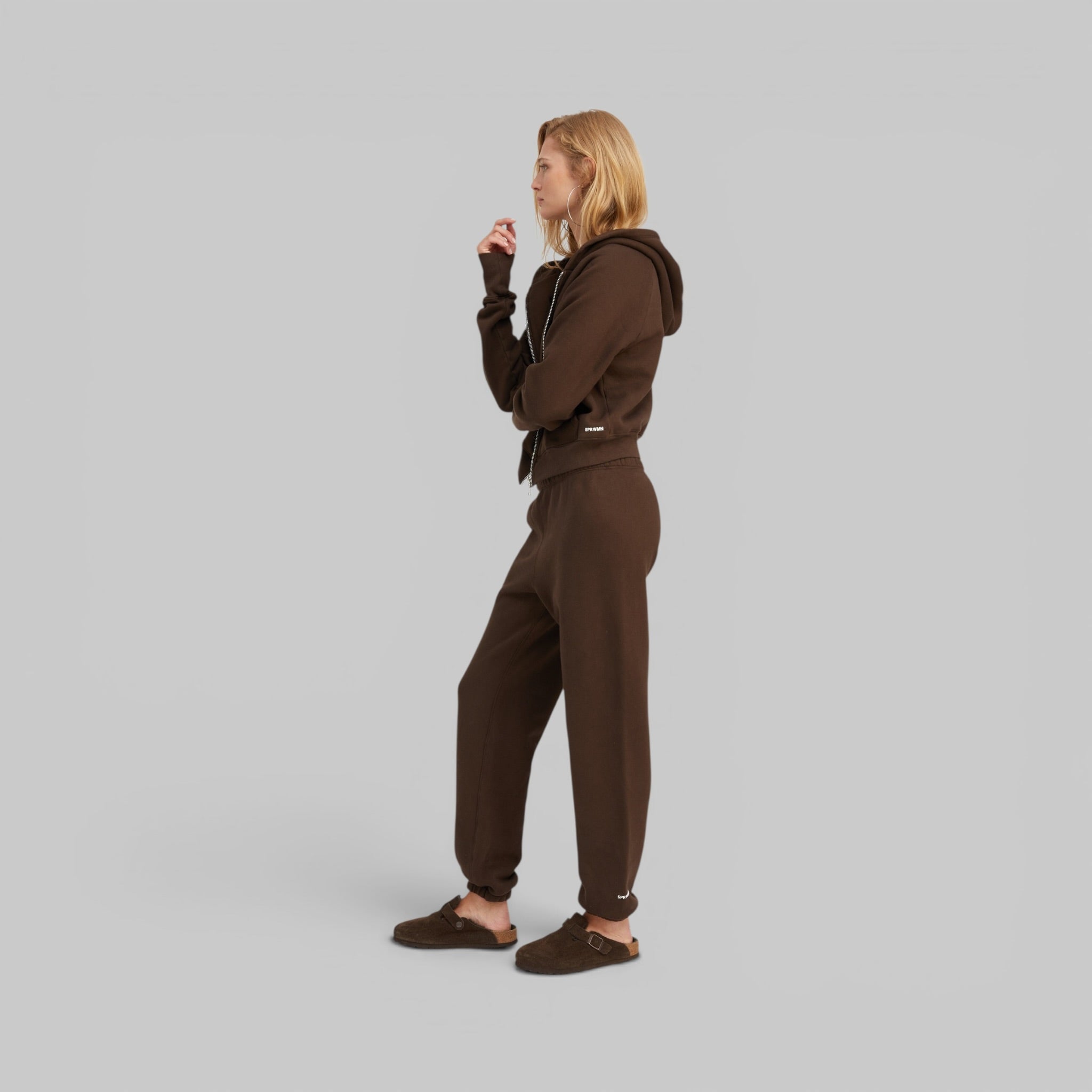 Shrunken Raglan Hoodie and Mini Logo Sweatpants by SPRWMN, styled together, detail view