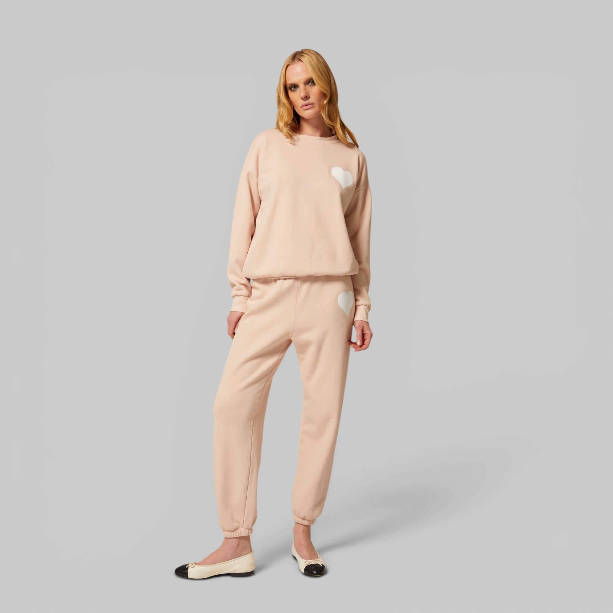 Heart Sweatpants and Heart Sweatshirt by SPRWMN, styled together, side view