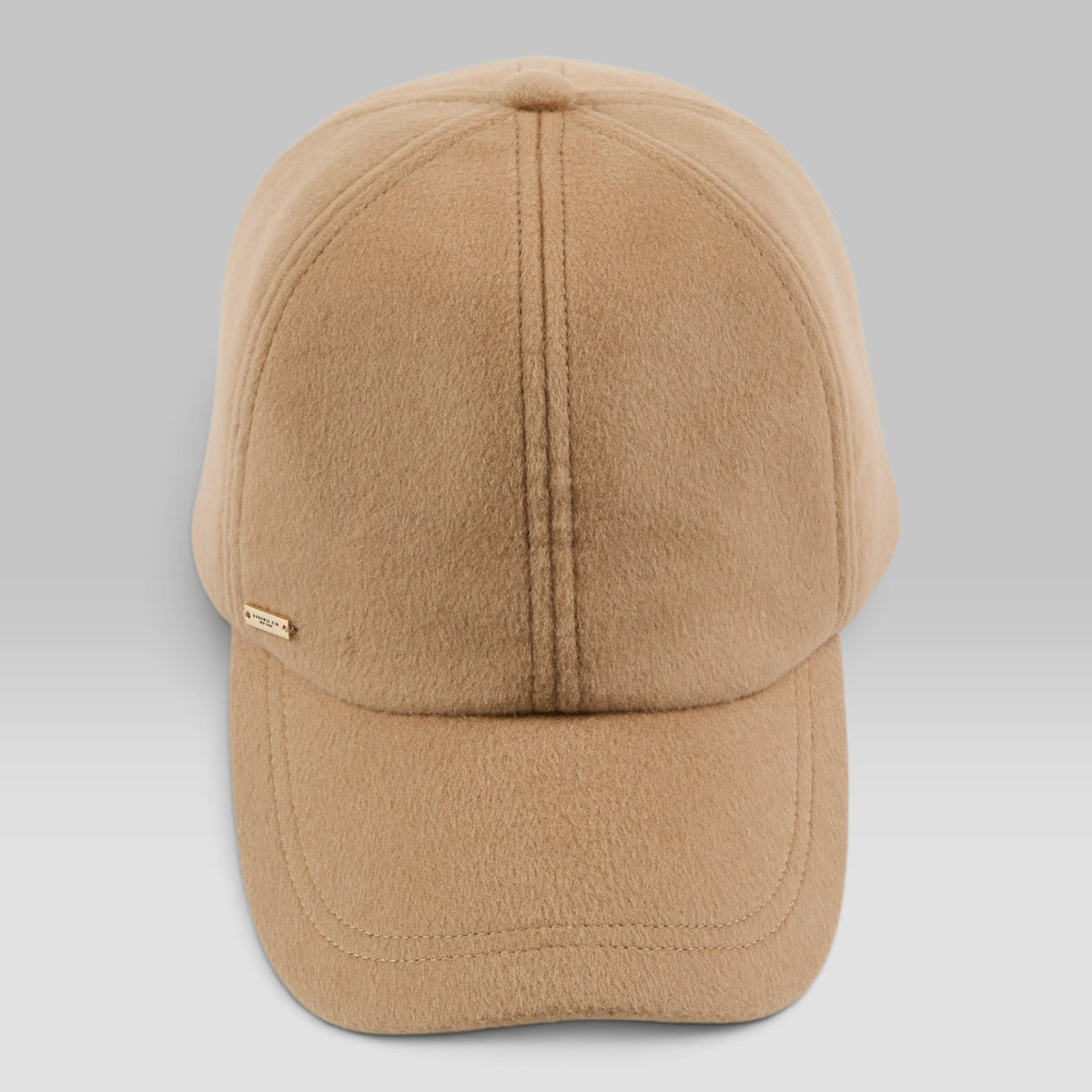 Lo Cap by Eugenia Kim, cashmere cap with 14KT gold logo plate in Camel